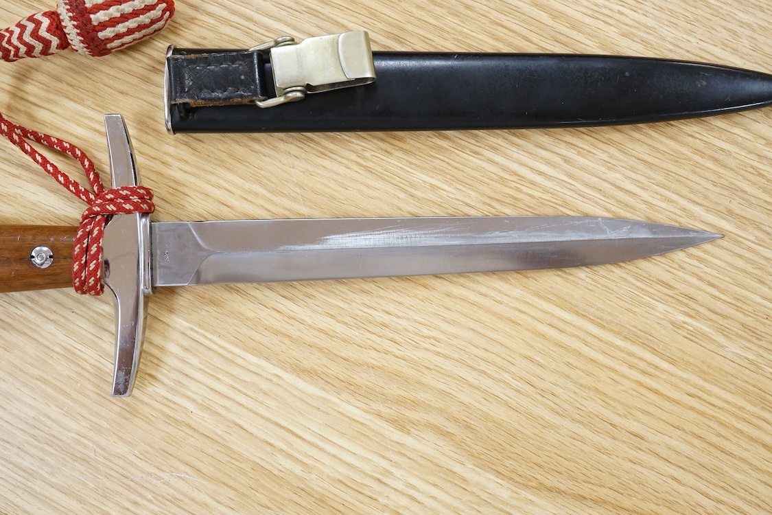 A post 1943 Swiss Army dagger, with knot and scabbard